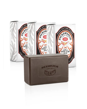 Packer's Pine front packaging showing three soap bars and woodsy branding benefit: authentic pine tar