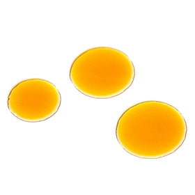 PAI SKINCARE golden rosehip oil poured on hand, shows silky texture and hydration benefit