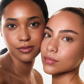 Palladio skin tint on a bathroom vanity staged with skincare to show daily routine use benefit