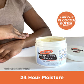 Palmer's solid balm melting on a spoon to show spreadable hydration