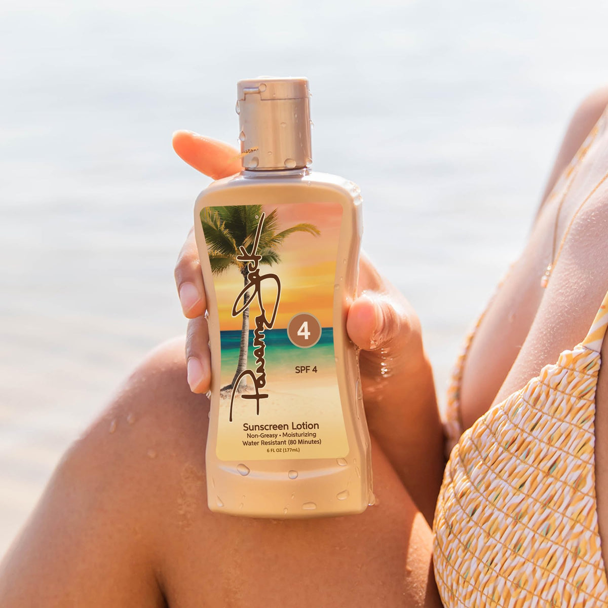 Panama Jack applied at poolside depicting water-resistant protection up to 80 minutes