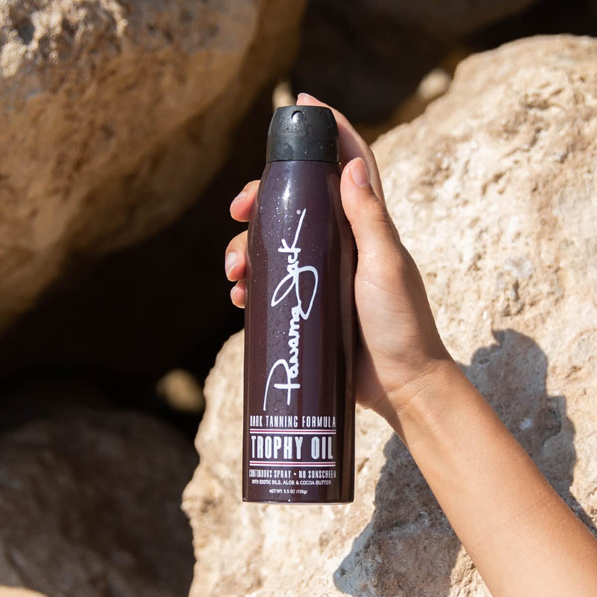 Panama Jack oil texture closeup highlighting smooth, lightweight formula that conditions skin