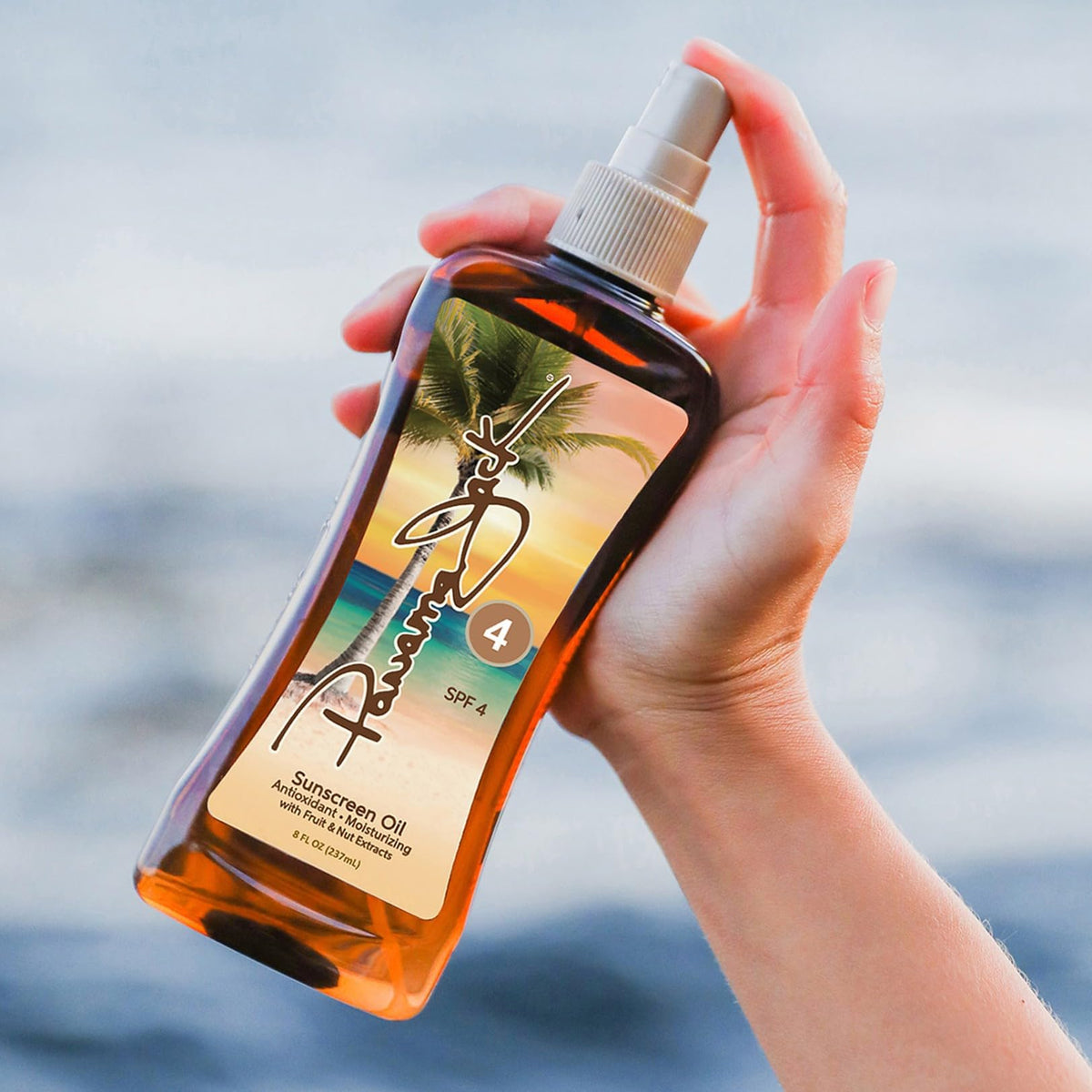 Panama Jack oil texture droplet on skin highlighting moisturizing sheen benefit