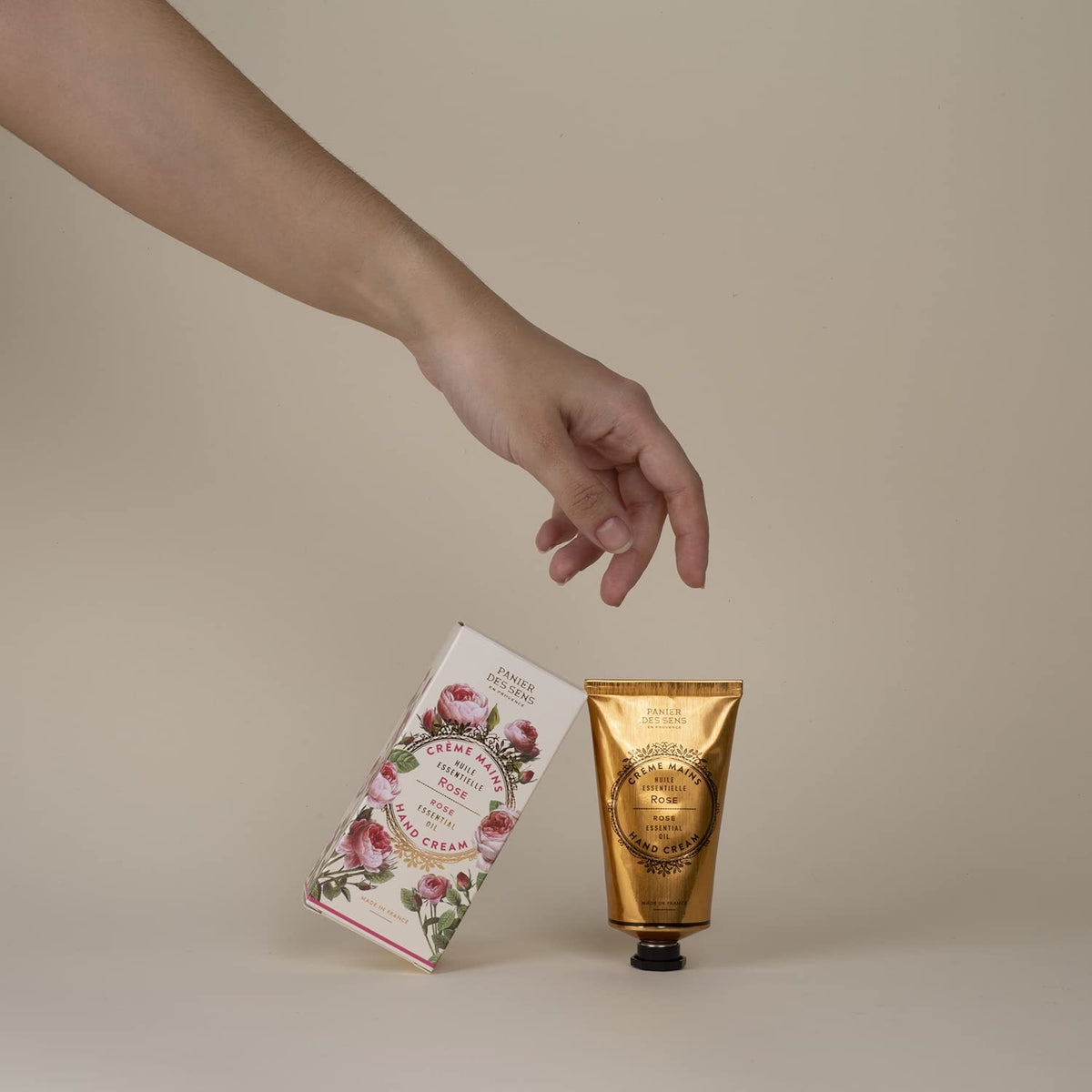 Panier des Sens on a vanity with rose petals giving a relaxing, fragrant care vibe