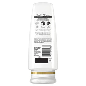Pantene bottles in hand showing 12.6 oz and 12 oz size for scale