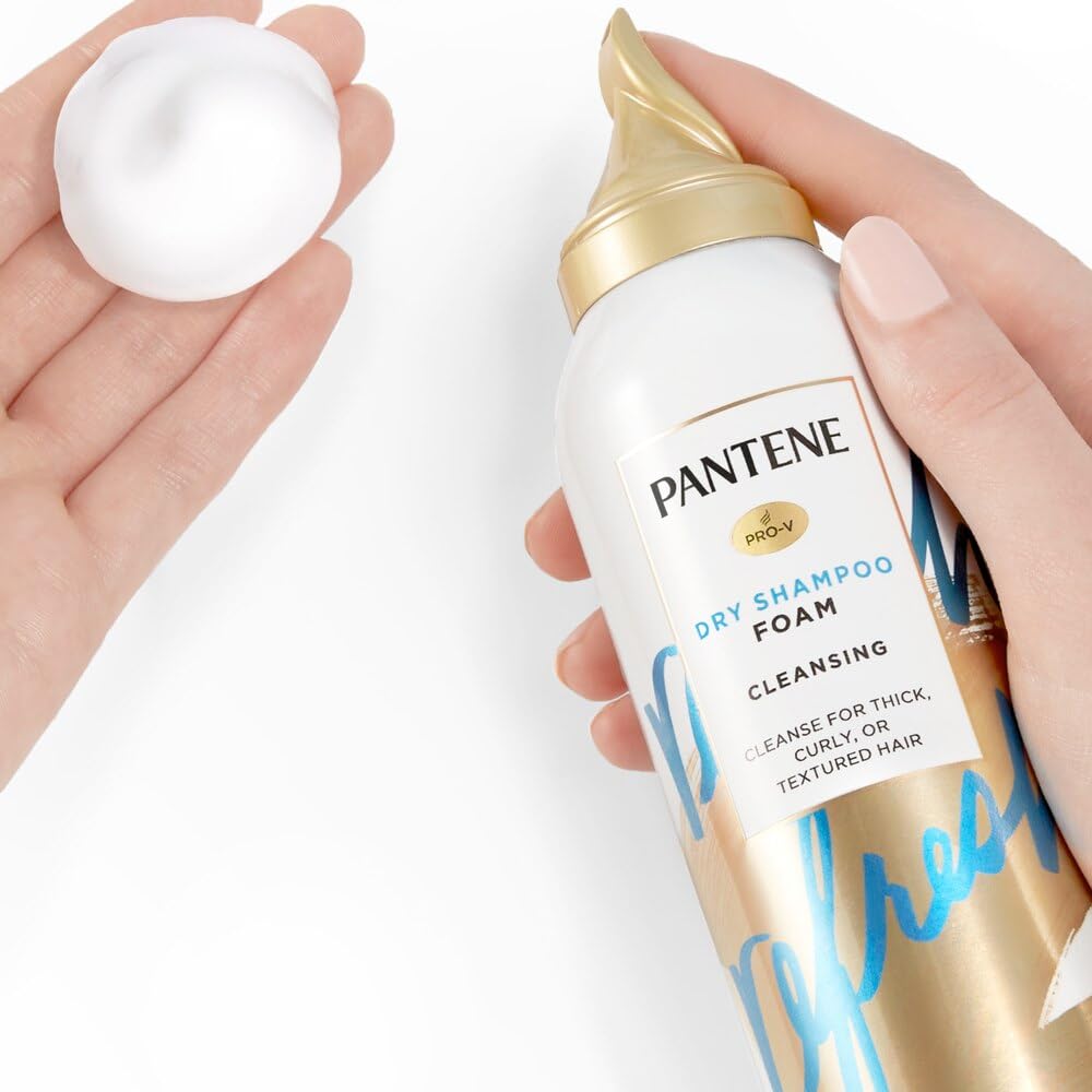 Pantene 5.9oz next to hands for size reference and travel-ready benefit