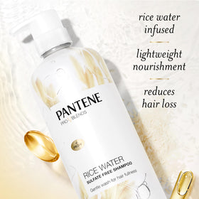 Pantene shampoo being massaged into wet hair to reduce breakage