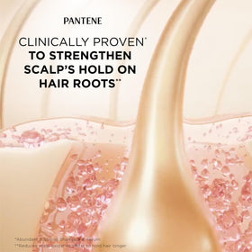 Pantene bottles in hand showing scale and travel-friendly sizes