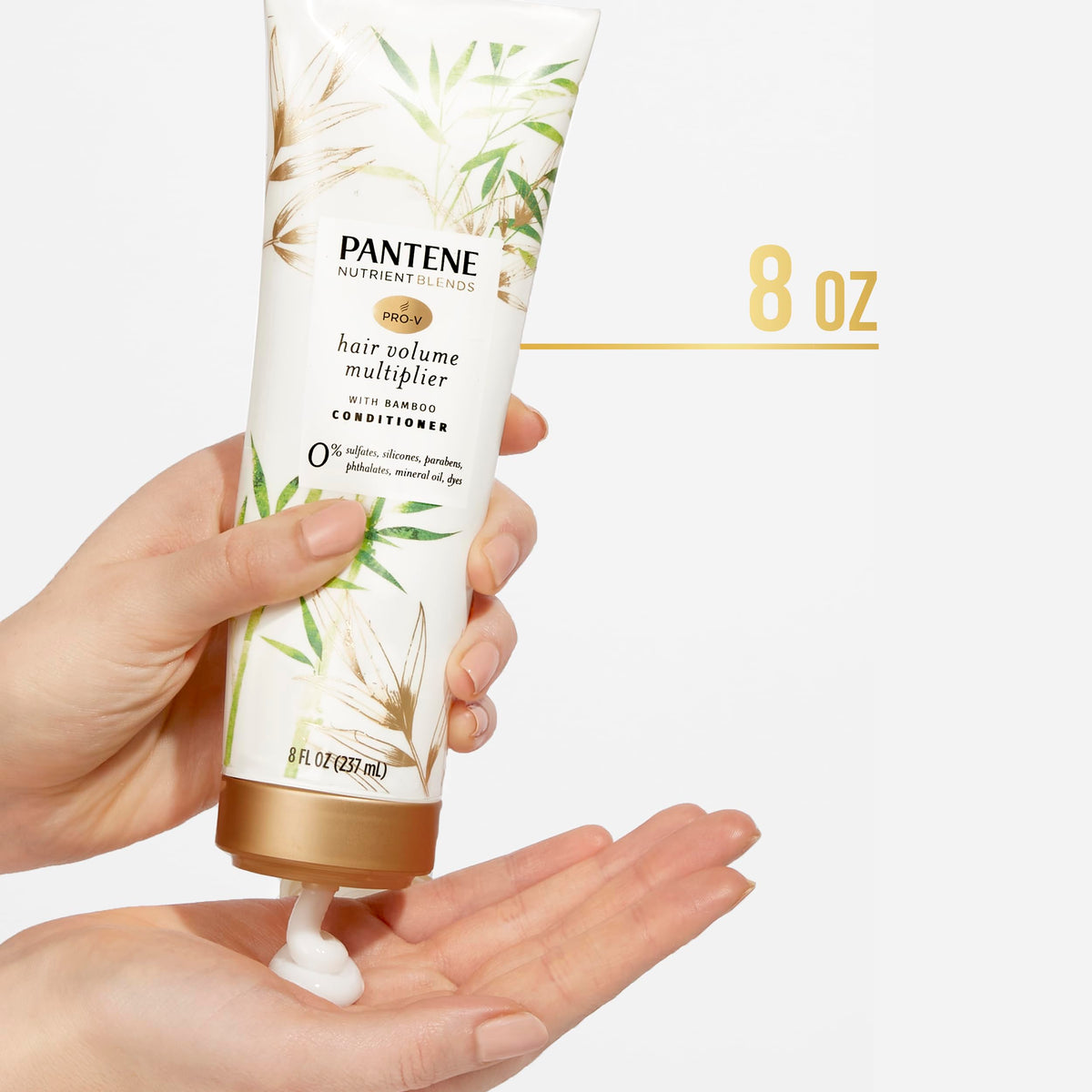 Pantene bottle held in hand to show scale and travel-friendly size