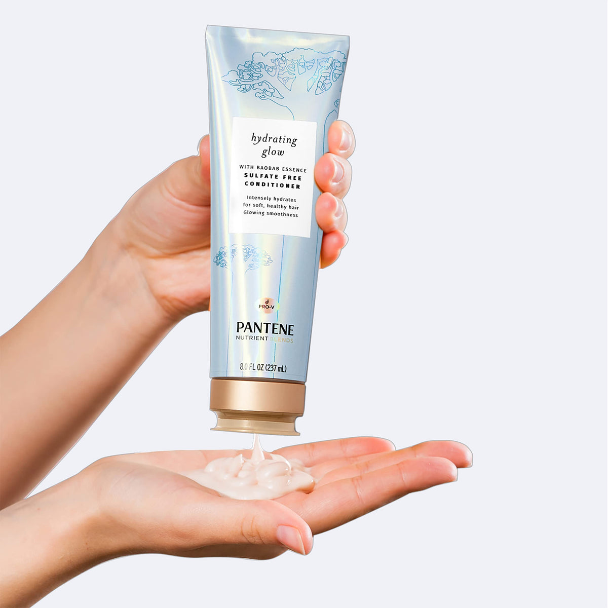 Pantene 8 oz bottle next to hand showing product scale