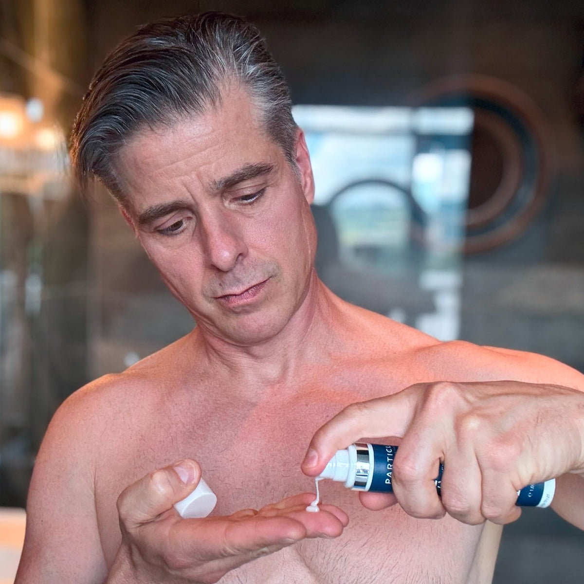 Particle kit size comparison with hand showing compact, travel-friendly benefit