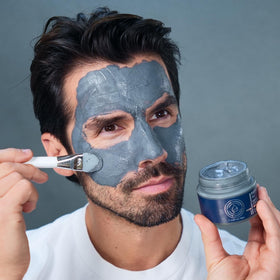Particle open jar revealing charcoal-tinged clay and mineral-rich contents benefit