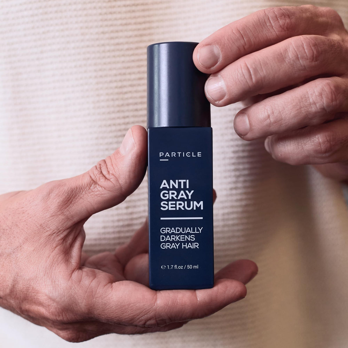 Particle serum massaged into scalp illustrating follicle-targeted delivery and comfort