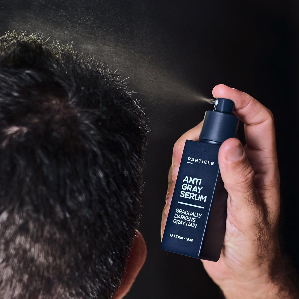 Particle serum next to ruler for size comparison indicating travel-friendly bottle