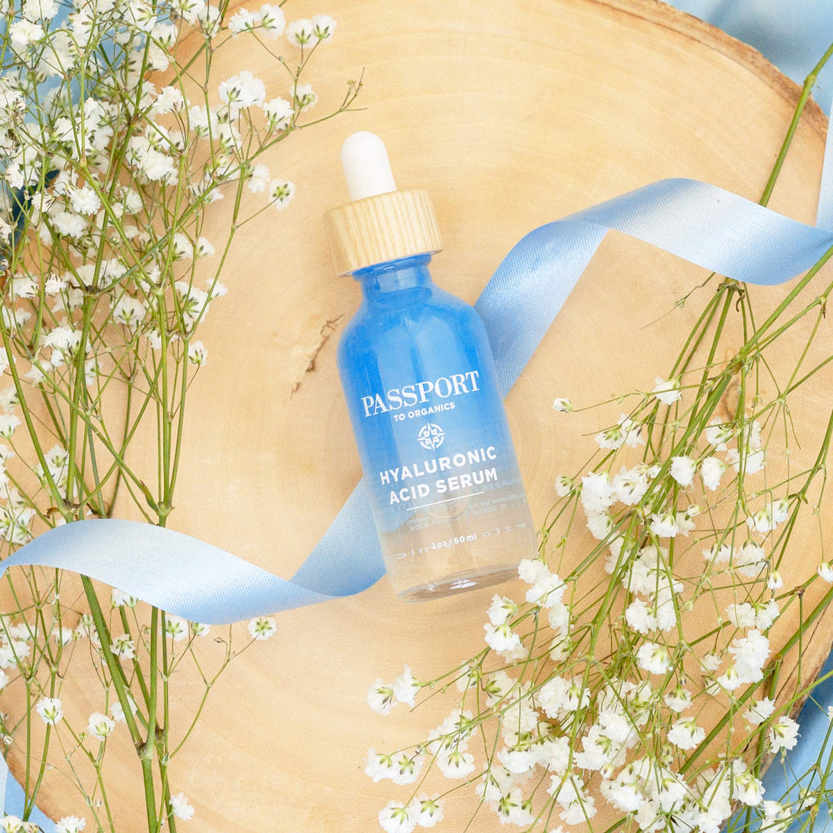 Passport to Organics applying serum to damp skin to boost immediate moisture