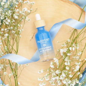 Passport to Organics applying serum to damp skin to boost immediate moisture