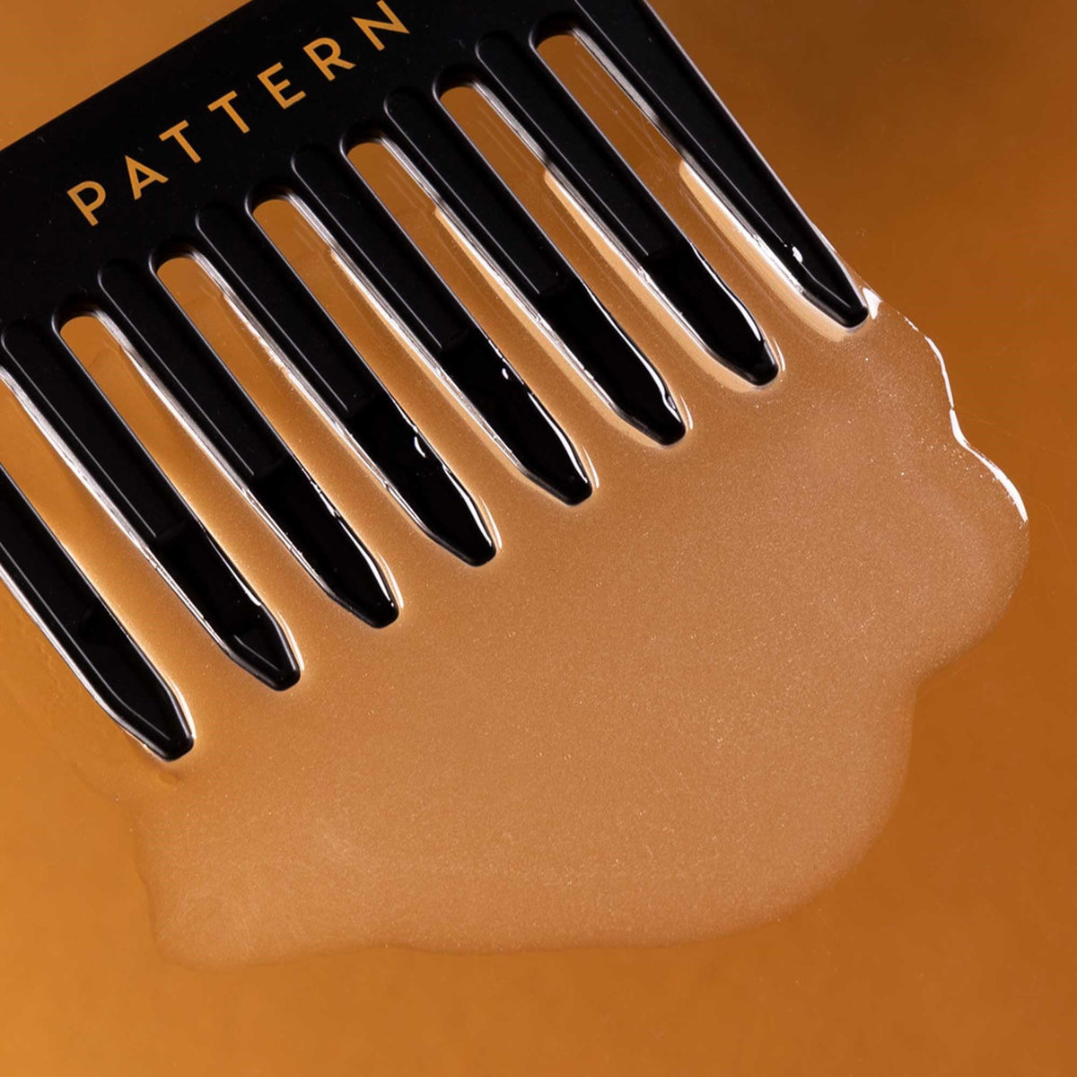 PATTERN applied to wet curly hair demonstrating easier detangling and reduced tugging