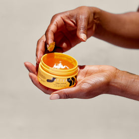 PATTERN jar next to hand showing compact size and travel-friendly convenience