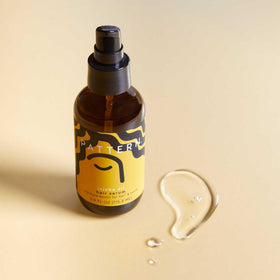 PATTERN bottle on bathroom shelf in styled setting suggesting daily routine ease and aesthetic appeal