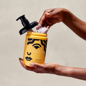 PATTERN applying leave-in to damp hair demonstrating slip for easier detangling