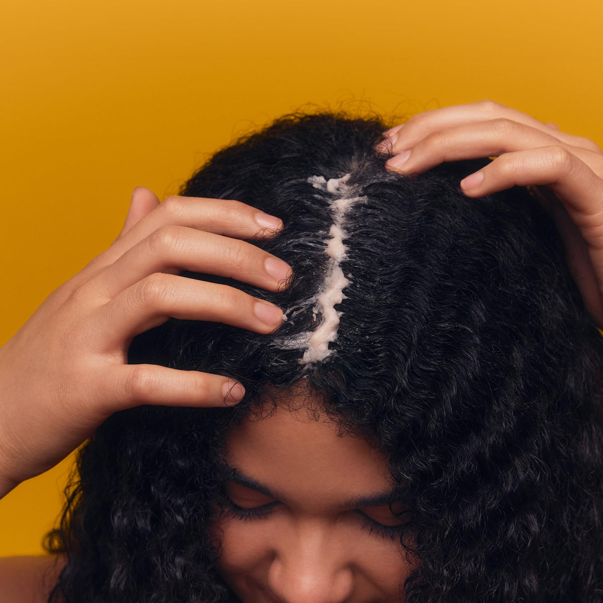 PATTERN application on wet textured hair demonstrating easy-rinse exfoliation benefit