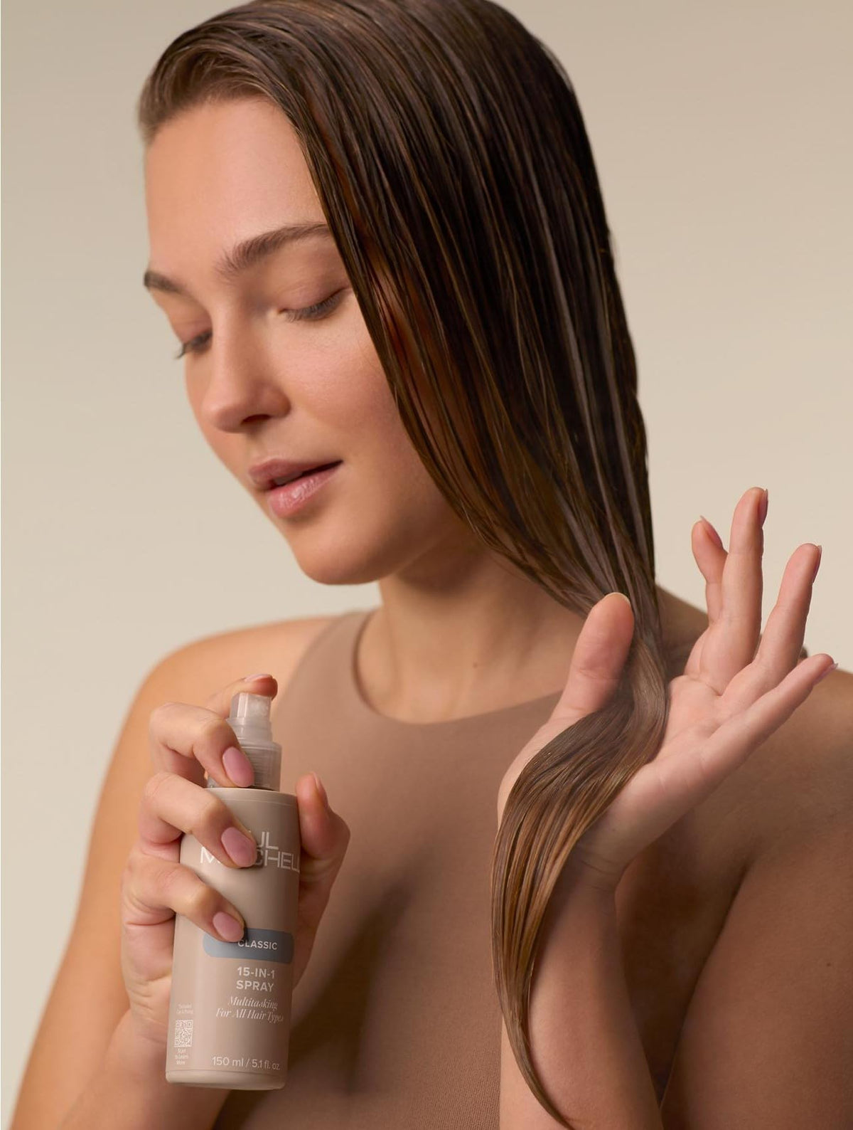 Paul Mitchell formula drop on hair strand highlighting smooth texture and shine