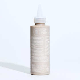 Paul Mitchell bottle on bathroom shelf showing convenient travel size