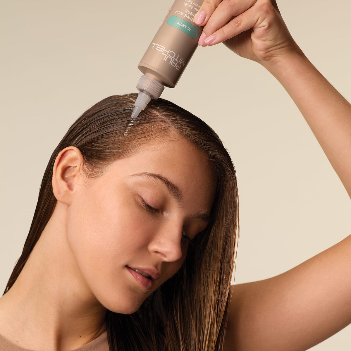 Close-up foam texture of Paul Mitchell rinse demonstrating gentle exfoliation