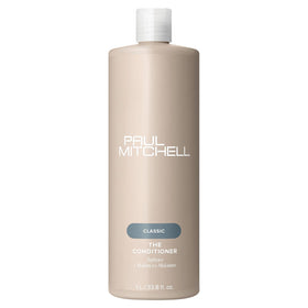 Paul Mitchell duo in a bathroom styling lifestyle scene illustrating salon-quality results and everyday manageability