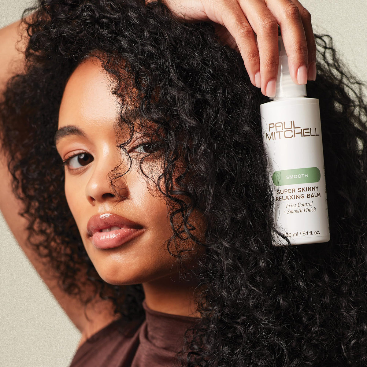 Paul Mitchell before and after shot showing reduced frizz and sleeker styled hair