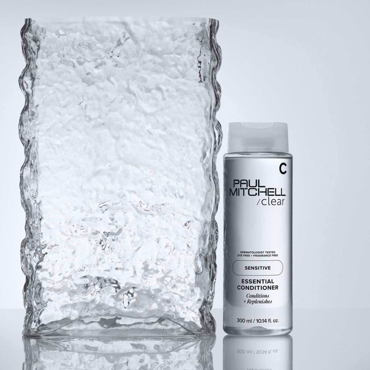 Paul Mitchell bottle in shower lifestyle showing gentle daily use benefit