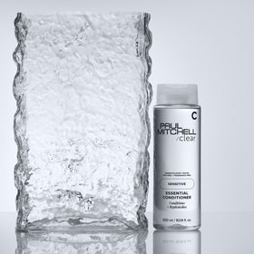 Paul Mitchell bottle in shower lifestyle showing gentle daily use benefit