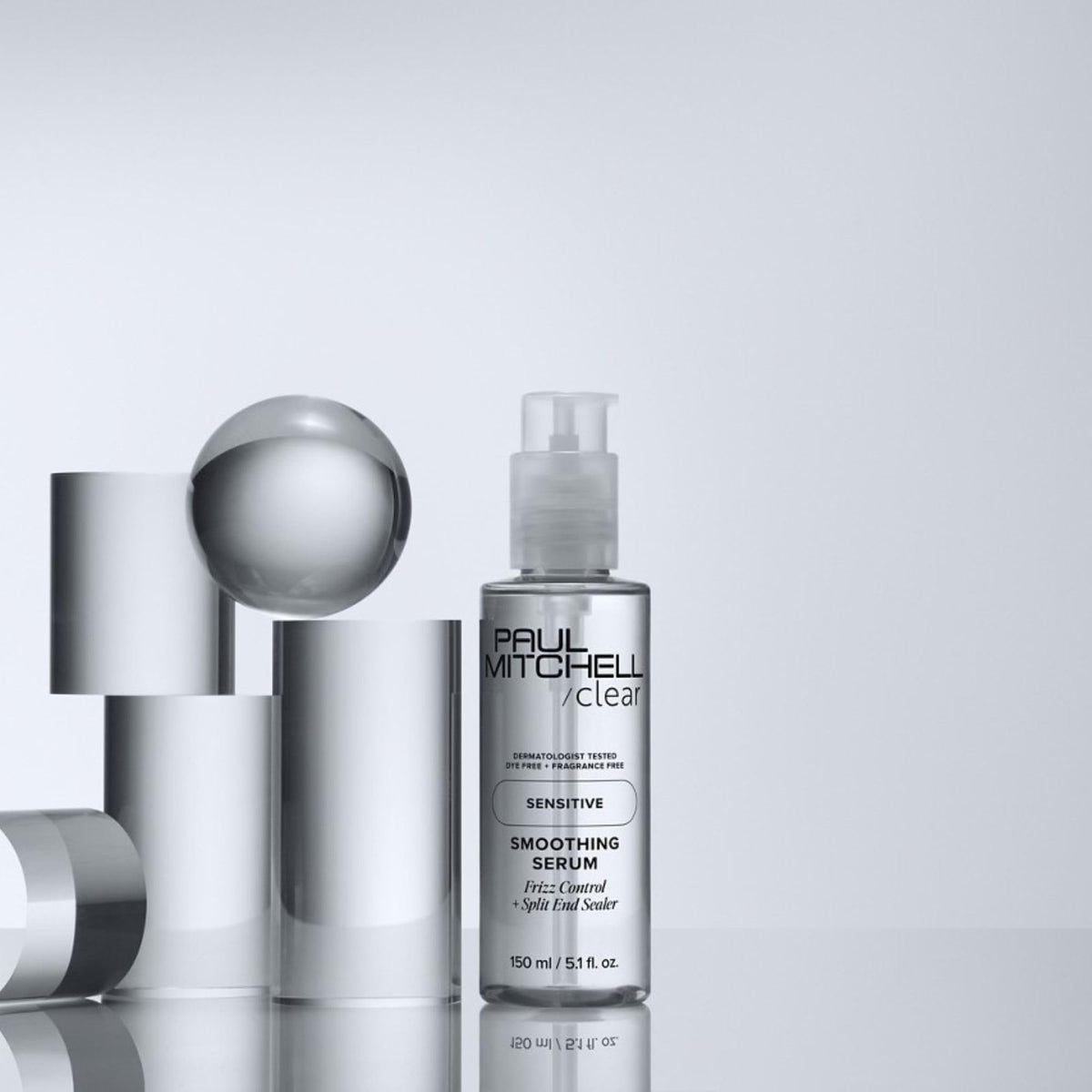 Paul Mitchell bottle beside hair dryer showing faster blow-dry performance