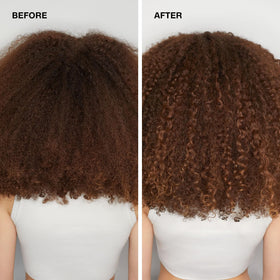 Paul Mitchell bottle held in hand conveying 10.14 fl oz size and travel convenience