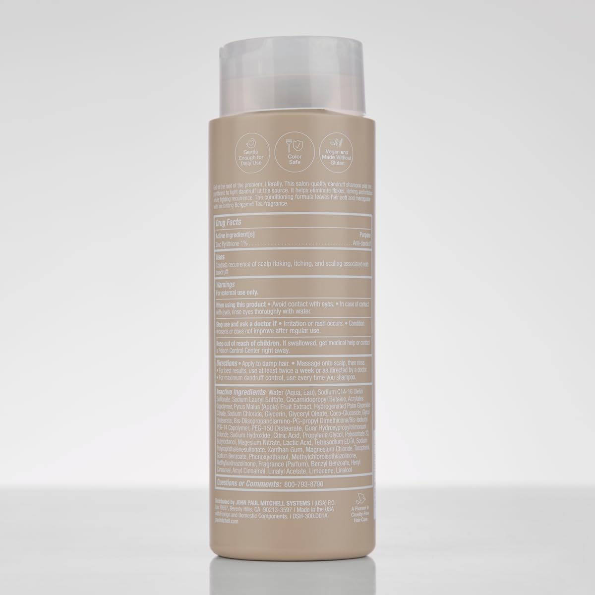 Paul Mitchell shampoo on shower shelf in bathroom lifestyle setting