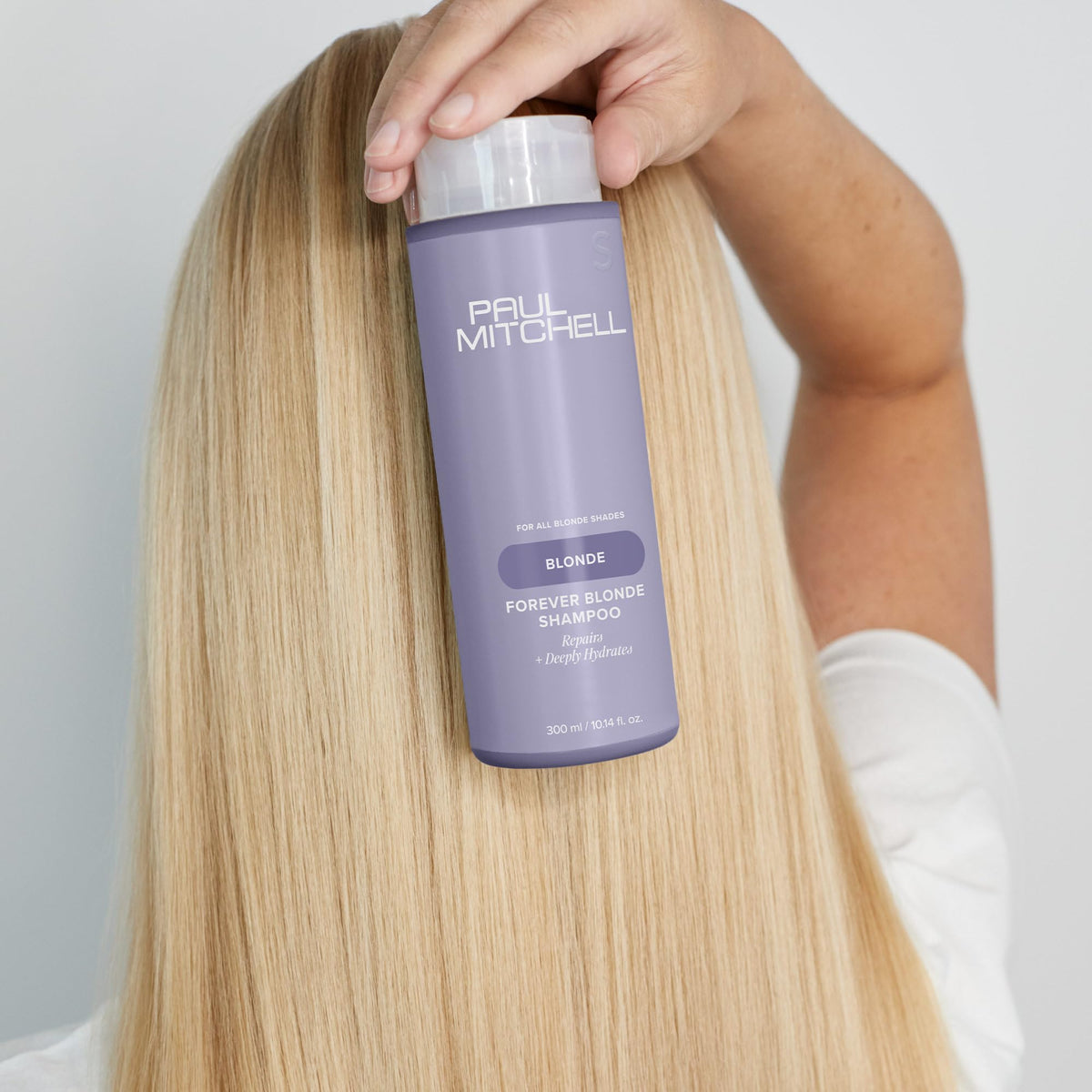 Paul Mitchell shampoo in use during shower for hydrated, manageable hair