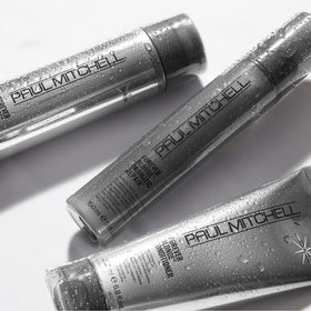 Paul Mitchell bottle staged on salon shelf conveying professional performance