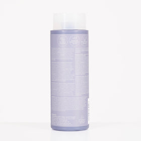 Recycled packaging label on bottle, Paul Mitchell reduced plastic environmental benefit