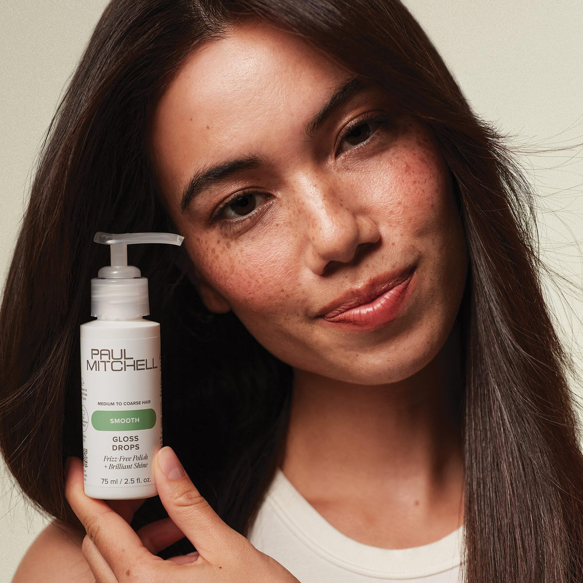 Paul Mitchell Gloss Drops used during blowout on medium-coarse hair for frizz control