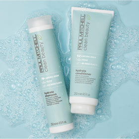 Paul Mitchell hydrate shampoo lather on wet hair demonstrating gentle cleansing