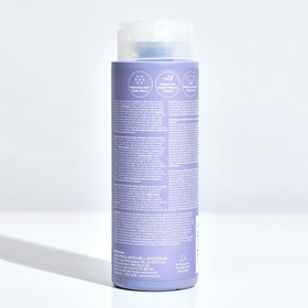 Paul Mitchell bottle styled on bathroom shelf in lifestyle scene promoting salon-quality at home