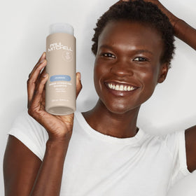 Paul Mitchell bottle staged in a bathroom setting suggesting everyday use
