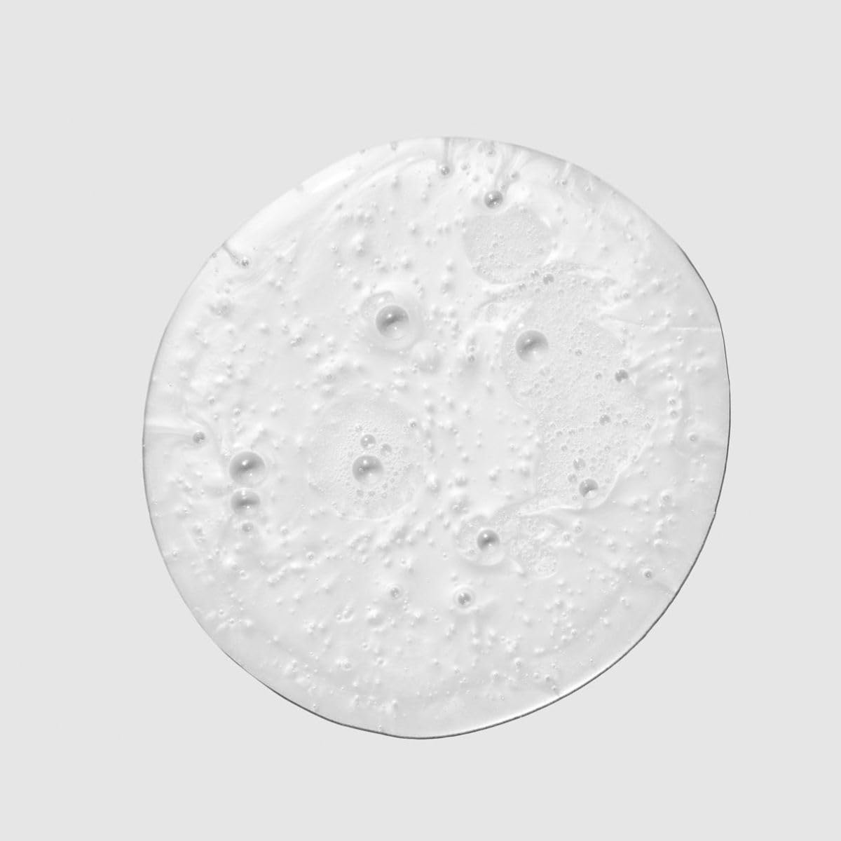 Paul Mitchell shampoo being poured with rich lather for easy detangling