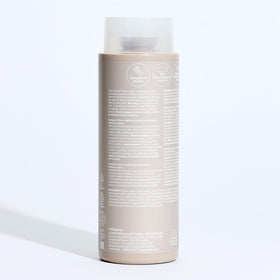 Visual of ingredients list on Paul Mitchell Shampoo Three bottle emphasizing mineral-removal
