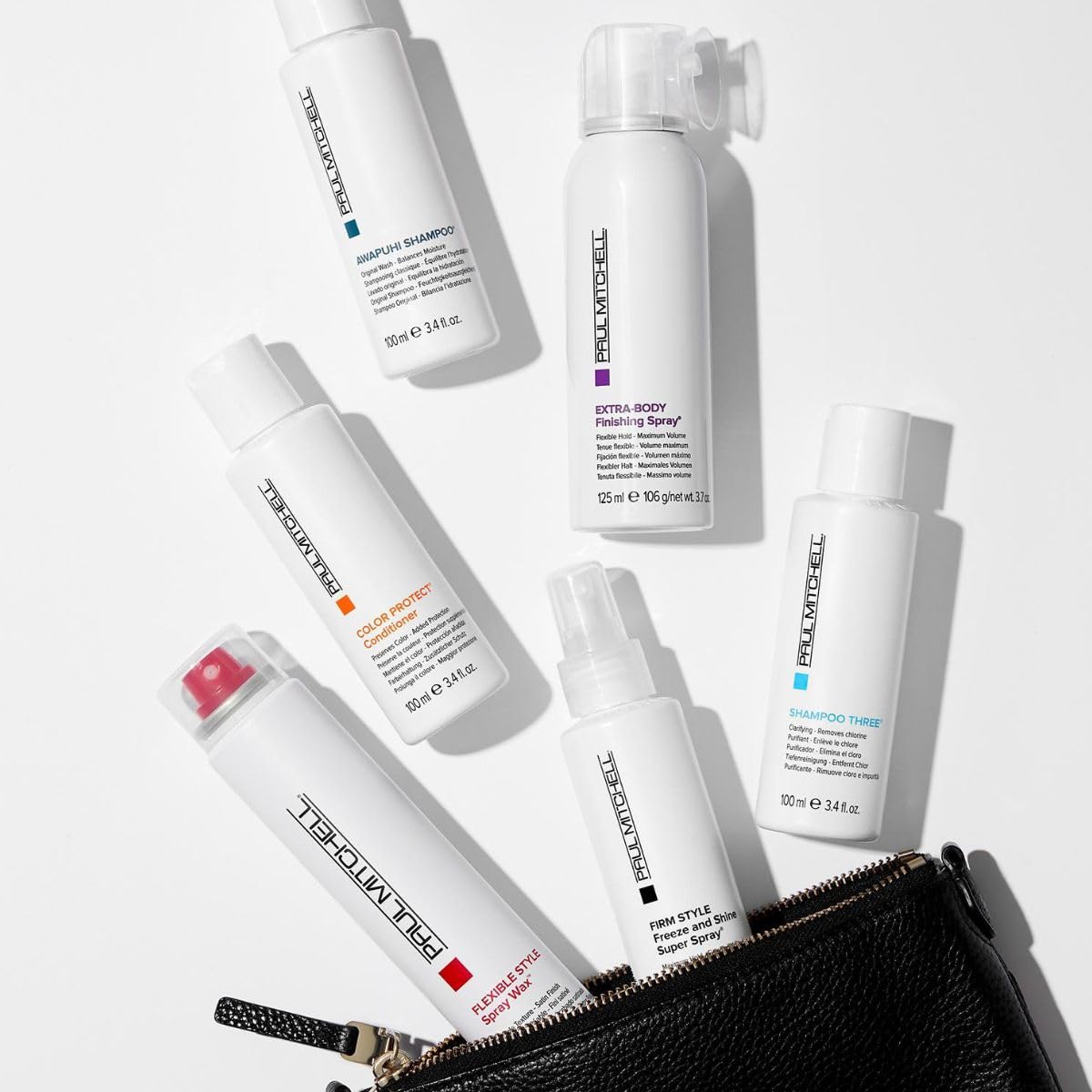 Paul Mitchell spray wax being applied to hair demonstrating quick texture and volume