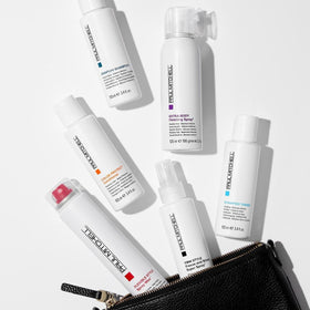 Paul Mitchell spray wax being applied to hair demonstrating quick texture and volume