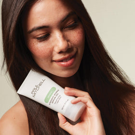 Paul Mitchell gel being applied to damp hair demonstrating even distribution and frizz control