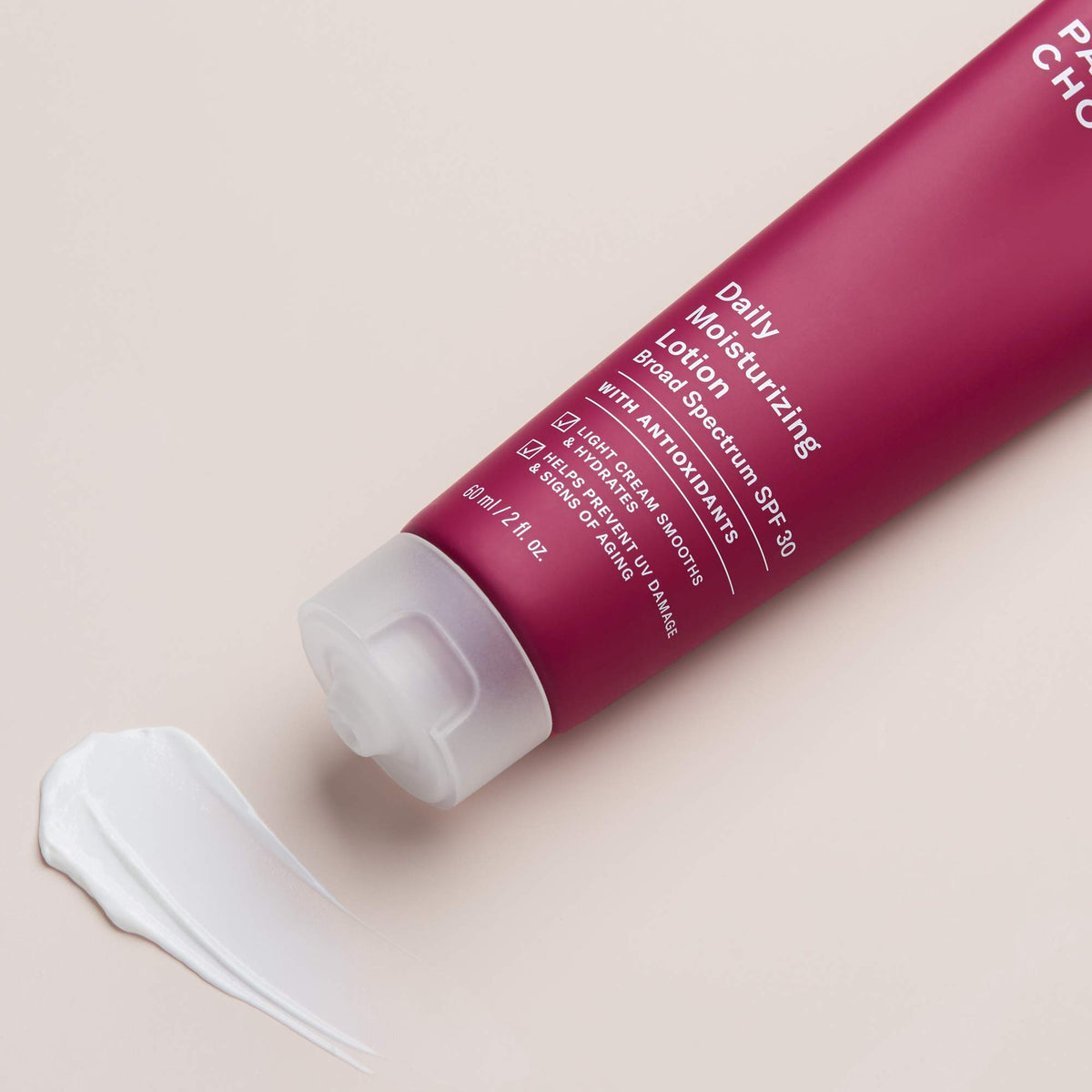 Paula's Choice applying lotion to face for soothing daily protection