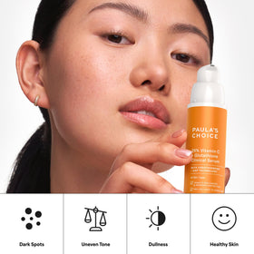 paula's choice bottle next to coin to illustrate 1 oz size and portability