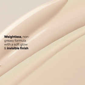 Paula's Choice 2oz tube next to coin for size and travel-friendly benefit